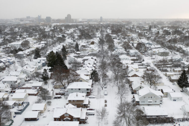 A storm brings squalls to the Northeast; 2 people die from heart attacks after shoveling snow
